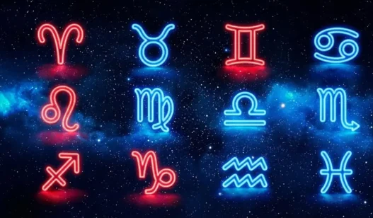 Simboli dello zodiaco illuminati da una luce rossa e blu su sfondo stellato