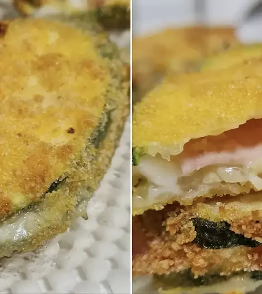 Involtini di zucchine croccanti con cuore di prosciutto e provola filante, cotti in friggitrice ad aria, serviti su un piatto con una spruzzata di olio